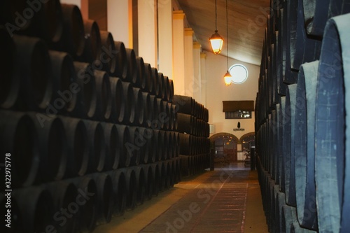 JEREZ, SPAIN: Barrels for wine in wine bodega of Sandeman. The Sandeman trading house was founded in 1790 on August 9, 2014 in Jerez, Spain photo