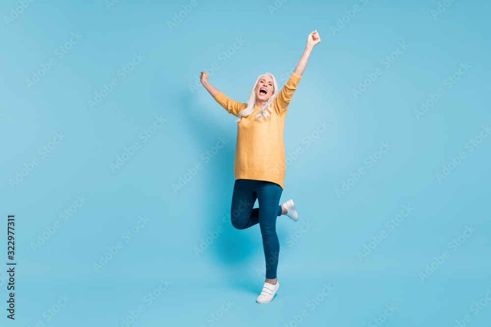 Full length body size view of her she nice attractive lovely cheerful cheery ecstatic dreamy lucky grey-haired woman celebrating having fun isolated on bright vivid shine vibrant blue color background Full length body size view of her she nice attractive lovely cheerful cheery ecstatic dreamy lucky grey-haired woman celebrating having fun isolated on bright vivid shine vibrant blue color background