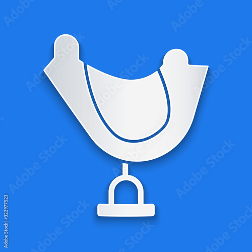 Paper cut Wild west saddle icon isolated on blue background. Paper art style. Vector Illustration