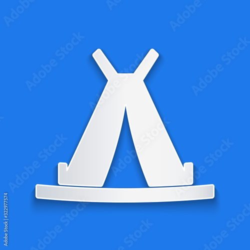 Paper cut Traditional indian teepee or wigwam icon isolated on blue background. Indian tent. Paper art style. Vector Illustration