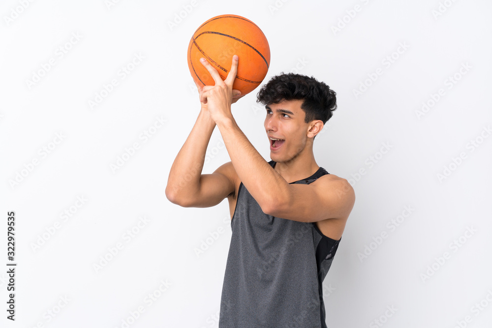 Young Argentinian man over isolated white background playing basketball