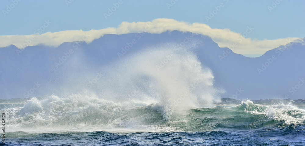 Wave Ocean Wave crashing ocean water power. Powerful ocean waves breaking. Wave on the surface of the ocean. Wave breaks on a shallow bank. Natural background stormy weather.South Africa