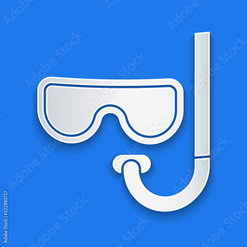 Paper cut Diving mask and snorkel icon isolated on blue background. Extreme sport. Diving underwater equipment. Paper art style. Vector Illustration