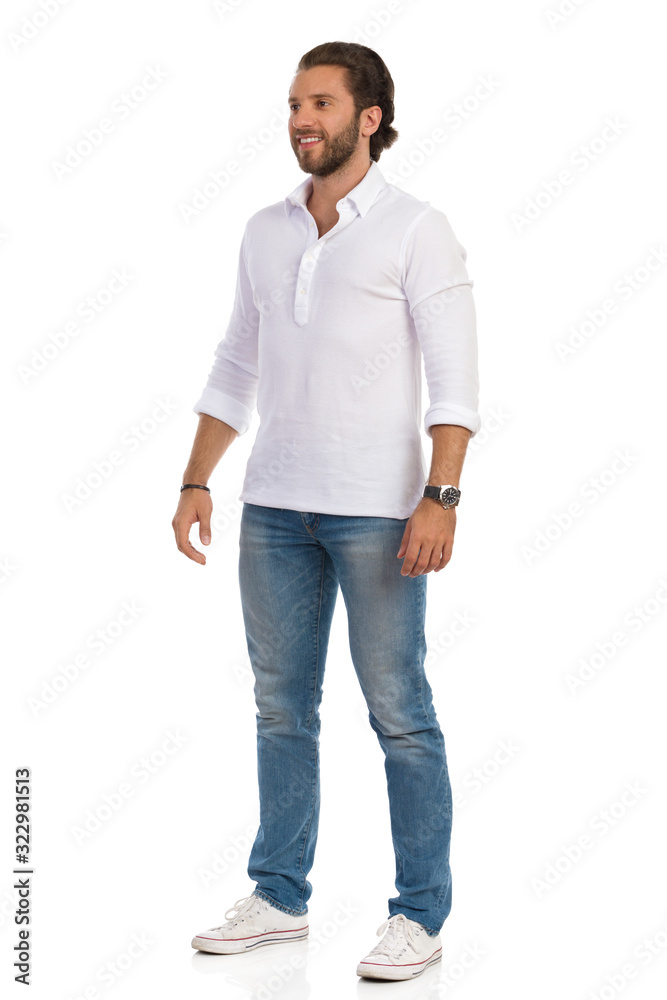 Handsome Young Man Is Standing Relaxed And Looking Away Handsome Young Man Is Standing Relaxed And Looking Away