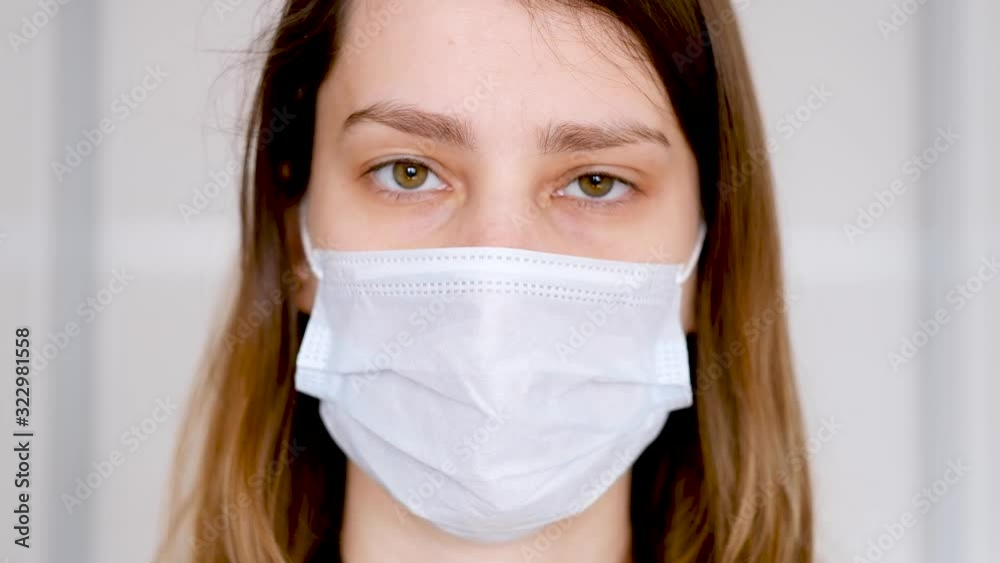 Woman wearing face mask protective for spreading of flu disease virus, protection against influenza viruses and diseases. Girl wearing surgical mask on face against coronavirus in the city. Woman wearing face mask protective for spreading of flu disease virus, protection against influenza viruses and diseases. Girl wearing surgical mask on face against coronavirus in the city.