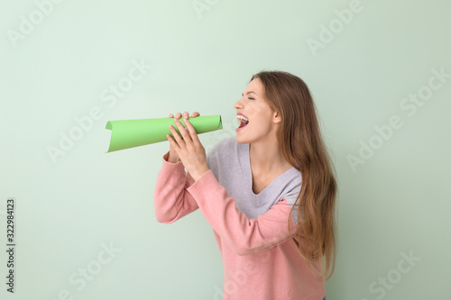 Young woman with paper mega...