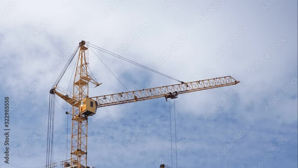 Crane Working on Construction Site time lapse. against the blue sky a clear day 4 K Crane Working on Construction Site time lapse. against the blue sky a clear day 4 K