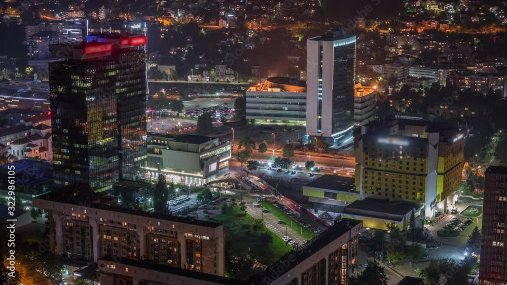 Aerial view of the southern part of Sarajevo city night timelapse. Skyline with illuminated skyscrapers and mountains from tallest tower viewpoint. Bosnia and Herzegovina, Southeast Europe. Aerial view of the southern part of Sarajevo city night timelapse. Skyline with illuminated skyscrapers and mountains from tallest tower viewpoint. Bosnia and Herzegovina, Southeast Europe.