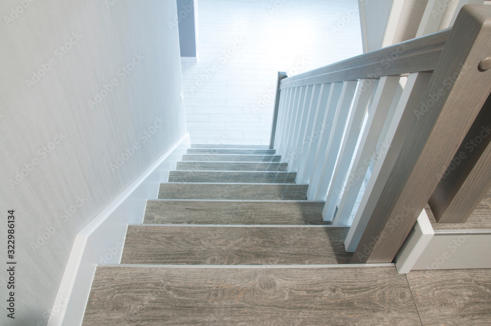 Fototapeta premium Wooden stylish staircase in the house. Interior.