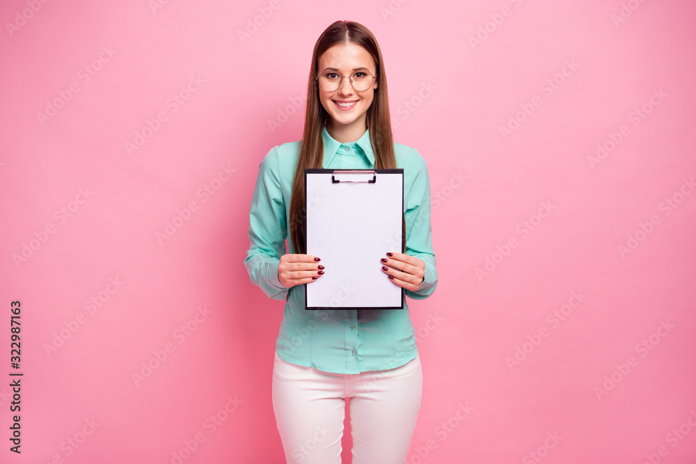 Portrait of confident smart professional marketer girl show clipboard with white empty paper for signature wear good look turquoise outfit isolated over pastel color background Portrait of confident smart professional marketer girl show clipboard with white empty paper for signature wear good look turquoise outfit isolated over pastel color background