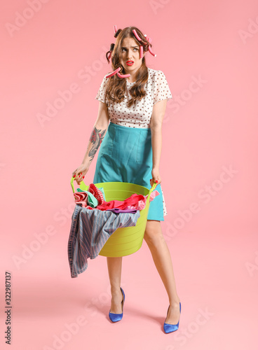Funny housewife with laundr...