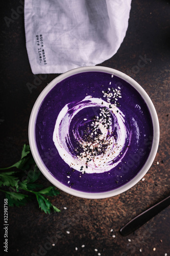 Red cabbage cream soup with sesame seeds and Greek yogurt garnish
