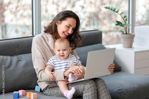 Working mother with her bab...
