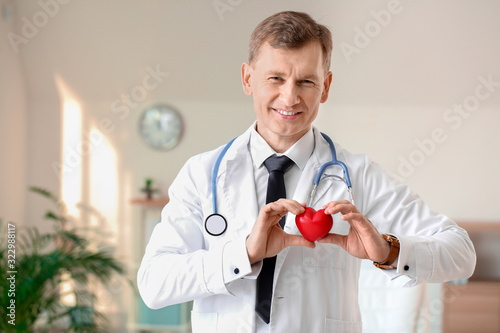 Male cardiologist in modern...
