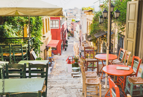 Charming street with cafe bars in old district of Plaka in Athens, Greece