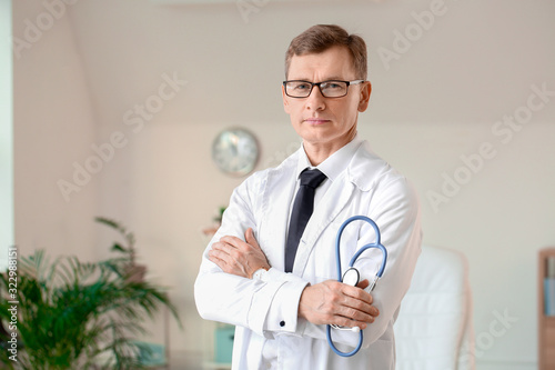 Male cardiologist in modern...