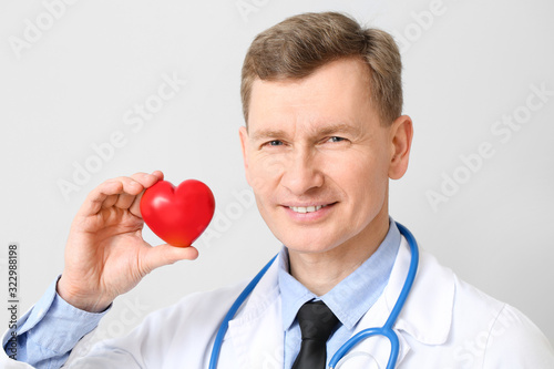 Male cardiologist on light ...
