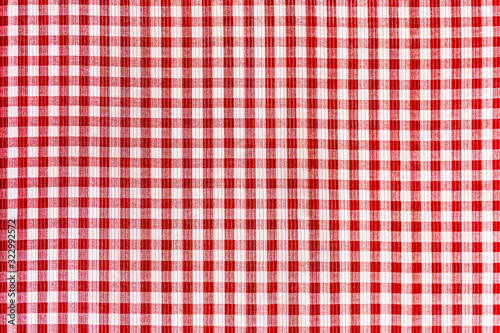 Red and white abstract checkered background, tablecloth, repeating fabric texture