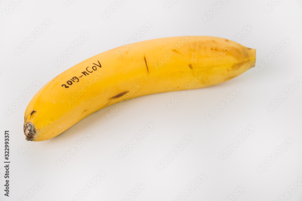 Banana with CORONAVIRUS text. Virus 2019-n CoV in Wuhan Banana with CORONAVIRUS text. Virus 2019-n CoV in Wuhan