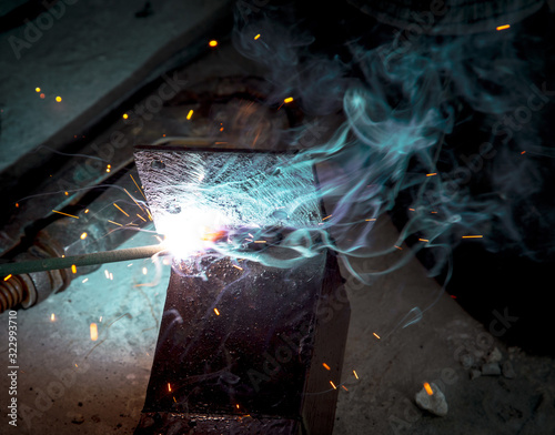 Sparks from welding at a construction site