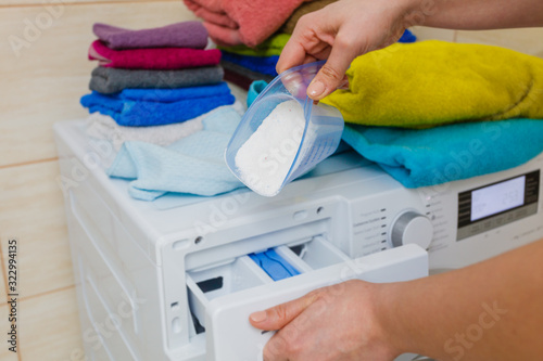 Hand pour washing powder into machine