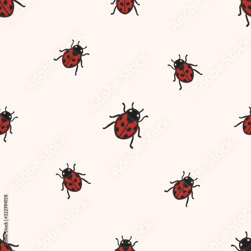 Vector seamless pattern with ladybug on light background. Great for fabric, textile, wallpaper