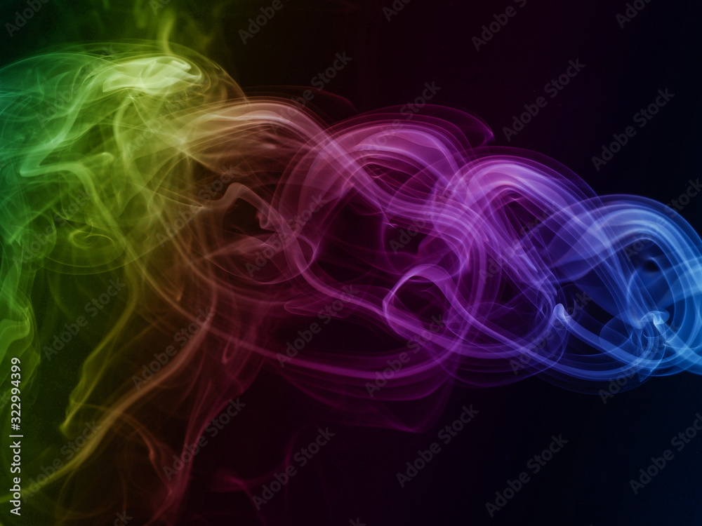 Fototapeta premium Abstract rainbow colored smoke on black
