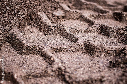 Wheel track in the gravel. Tire tracks in dirt ground. 