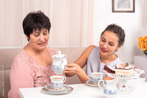 Tableau sur toile Shot of the mom and adult daughter spending time together at home