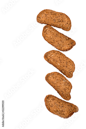 Slices of sliced ​​Dutch grain bread lie on white background