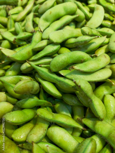 Green beans on the market as a background