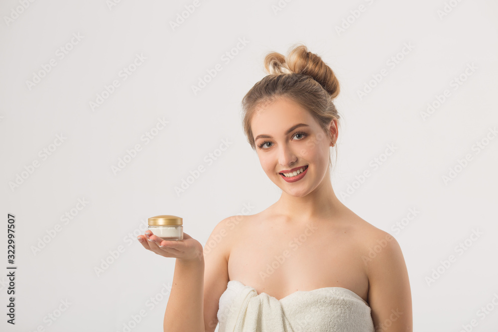beautiful young woman on a white background in a towel beautiful young woman on a white background in a towel