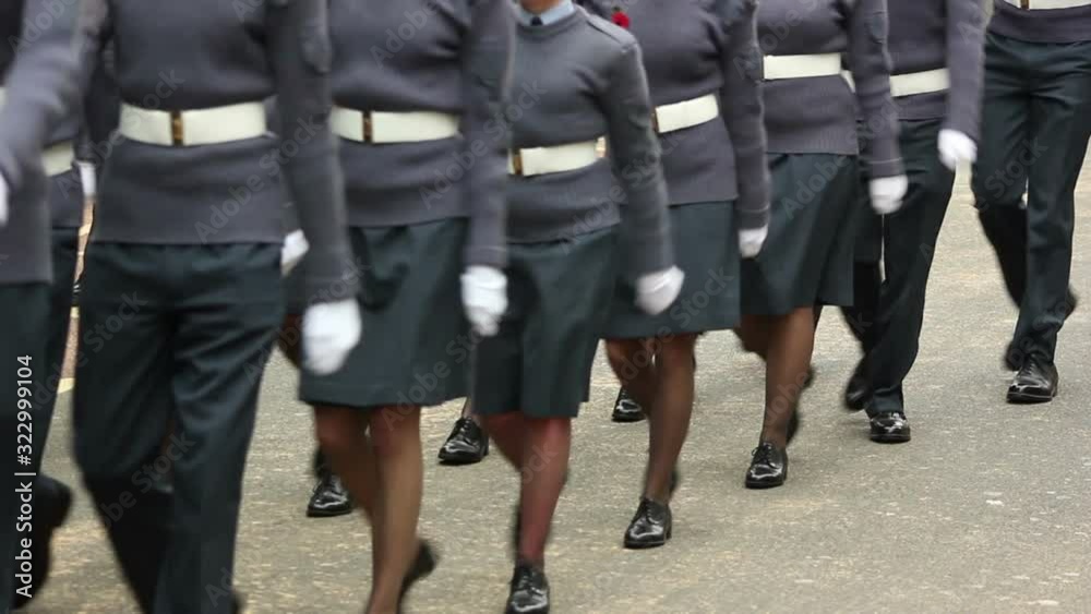 Royal Air Force Officers parade through the streets in homecoming parade. They march in formation in uniform. Marching. Stock Video Clip Footage Royal Air Force Officers parade through the streets in homecoming parade. They march in formation in uniform. Marching. Stock Video Clip Footage