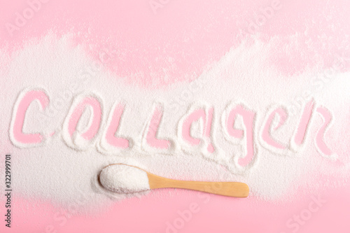 Scattered collagen on a pink background close-up. photo