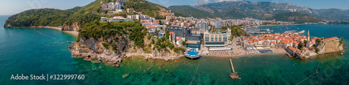 Aerial view of Mogren beach (two sandy beaches) and the old city (stari grad) of Budva. Montenegro. Jagged coast on the Adriatic Sea photo
