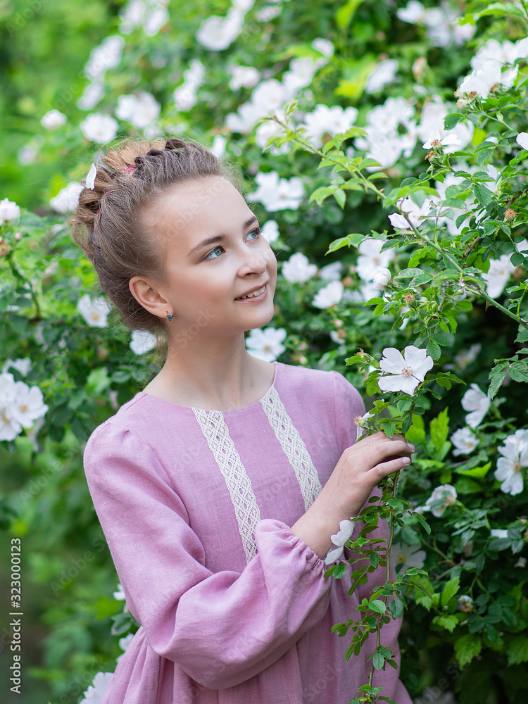 Portrait of a beautiful girl in nature, a girl walks in the park Portrait of a beautiful girl in nature, a girl walks in the park