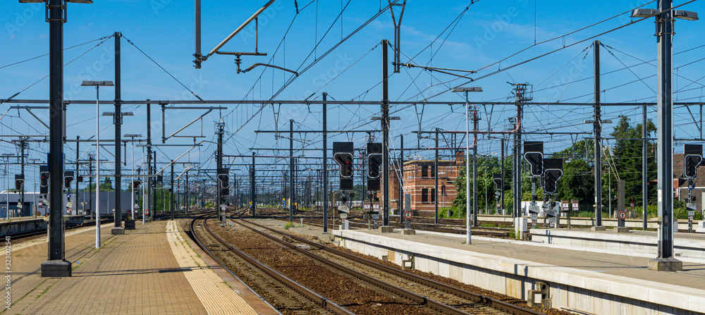 Panoramic landscape of railroad tracks with the catenary.