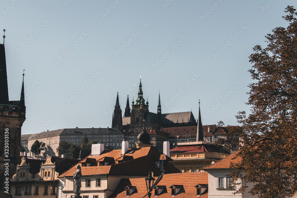 photo of city scape with Prague castle in the background at sunset