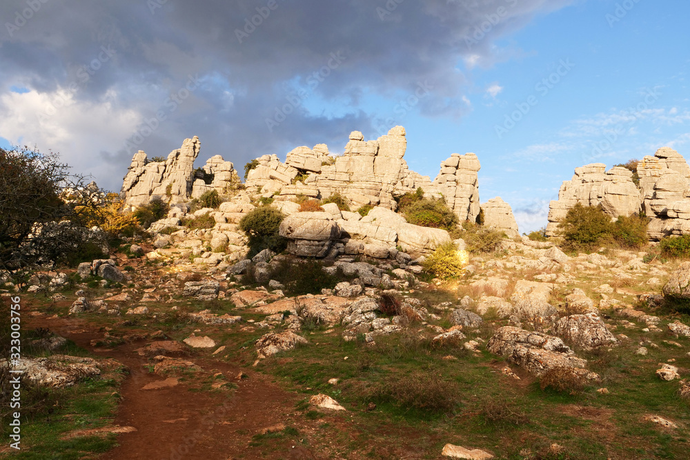 Impressive panorama view on beautiful limestone formations in the karst landscape of El Torcal de Antequera at sunset, Spain, Europe