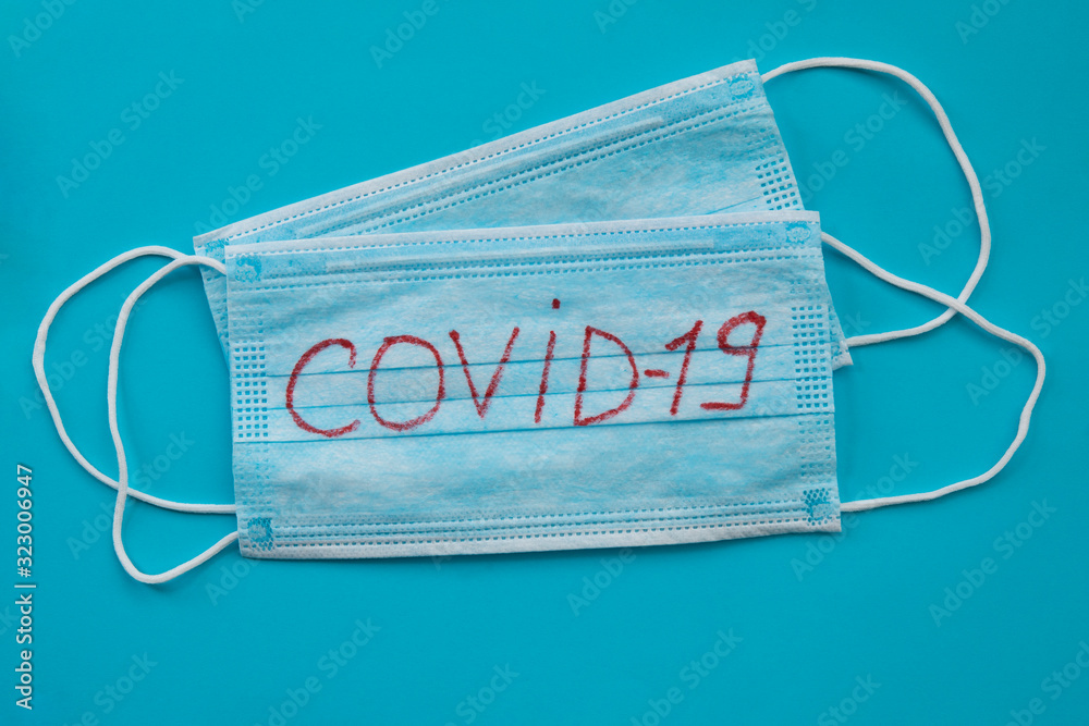 Surgical protective mask. Concept of coronavirus quarantine. Dangerous Chinese Novel virus COVID 19 pandemic risk alert. Surgical protective mask. Concept of coronavirus quarantine. Dangerous Chinese Novel virus COVID 19 pandemic risk alert.