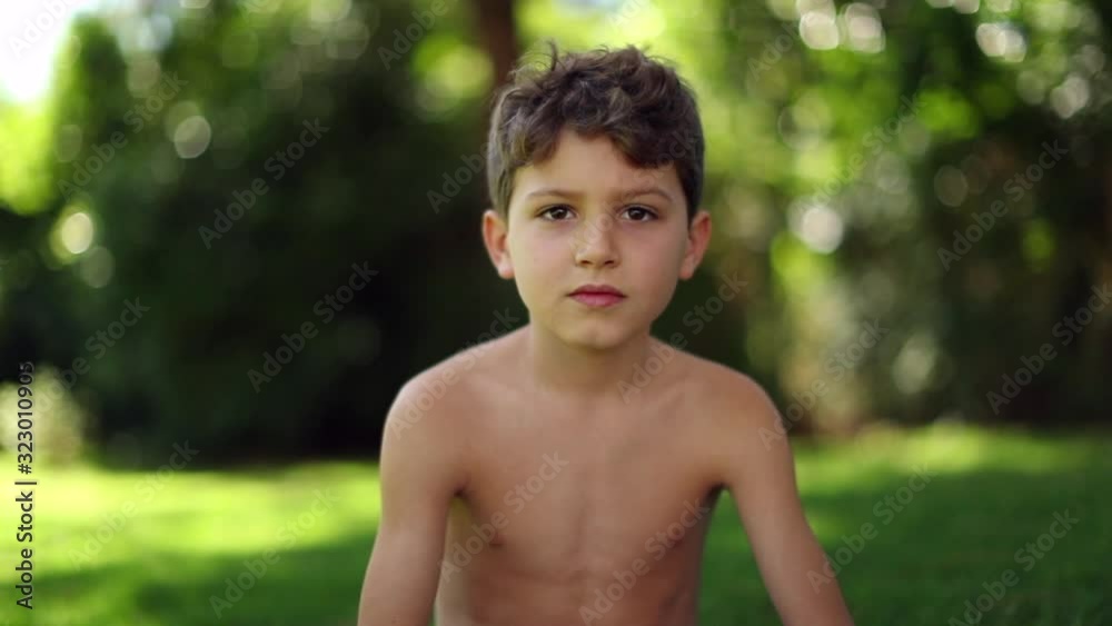 Handsome Child In Outdoor Garden Shirtless Young Boy Looking To Camera handsome-child-in-outdoor-garden-shirtless-young-boy-looking-to-camera