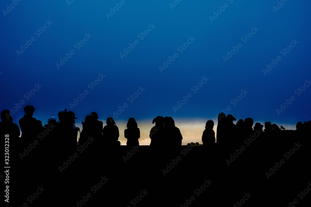 silhouette group of traveler are waiting see sunrise from top of mountain on new year 2020