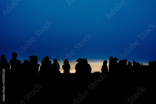 silhouette group of traveler are waiting see sunrise from top of mountain on new year 2020 © tickcharoen04