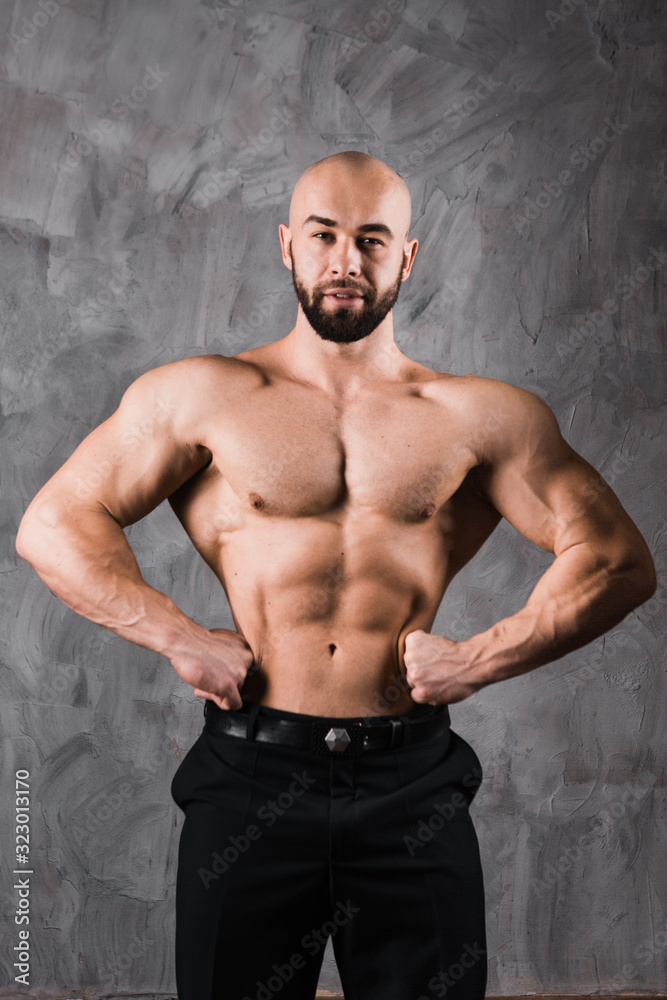 handsome muscular stylish bald man