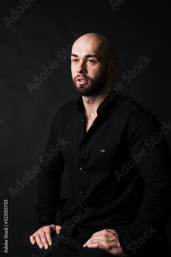 handsome muscular stylish bald man