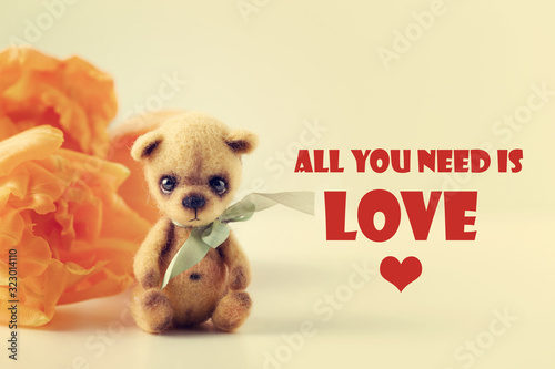 Teddy bear, tulips, text All You Need Is Love. Valentine's card, banner © 8H