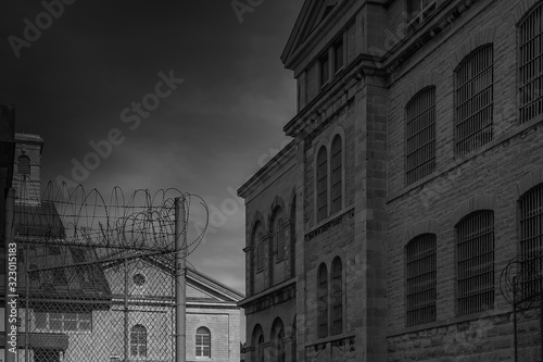 Obraz na płótnie Scene from Kingston Penitentiary exterior yard limestone buildings, barred windo