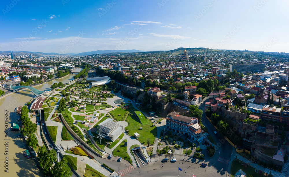 The panorama of the old town in the old district of Avlabari, Holy Trinity Cathedral and Rike Park, the Kura river in Tbilisi, Georgia.