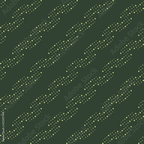 Seamless wallpaper on a dark grassy green background. Various uneven points, circles form a twisted diagonal pattern. Design for textiles, wall coverings, fabrics, scrapbooking, decor, web