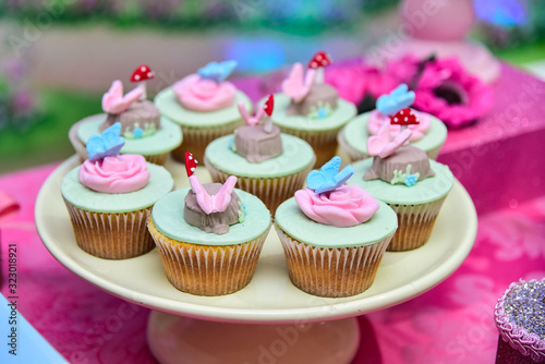 cupcakes with pink frosting and sprinkles, themed cupcake, pink butterfly cupcake, blue butterfly cupcake, children's party, birthday party